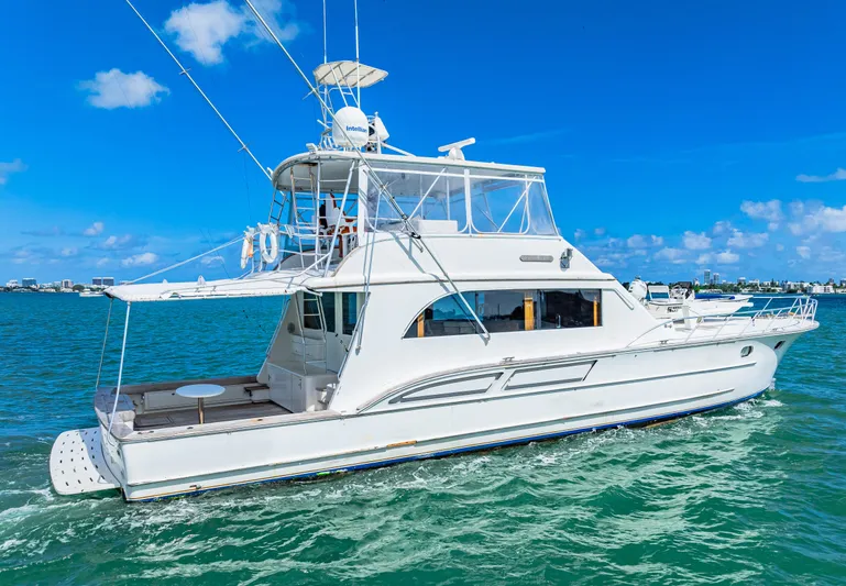 Bahama Belle Yacht Photos Pics 1996 Blackwell 72 yacht cruising on clear blue water under a sunny sky.