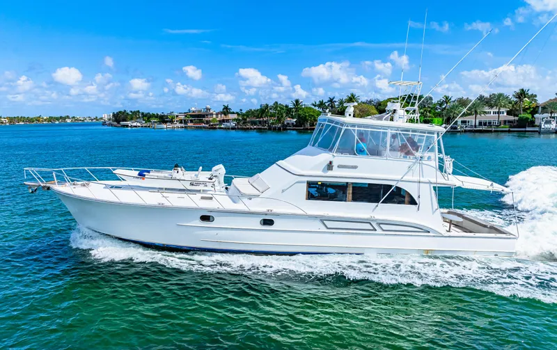 Bahama Belle Yacht Photos Pics 1996 Blackwell 72 yacht cruising on clear blue water.