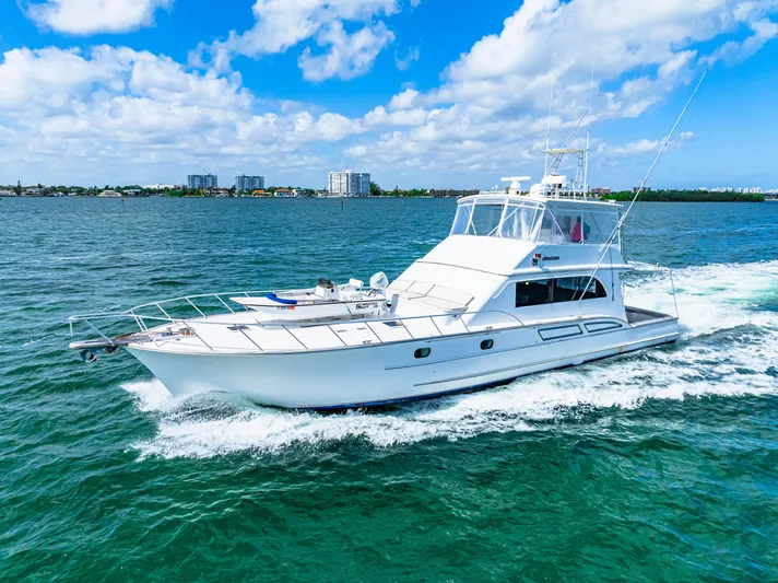 Bahama Belle Yacht Photos Pics 1996 Blackwell 72 yacht cruising on a sunny day with blue skies and calm waters.