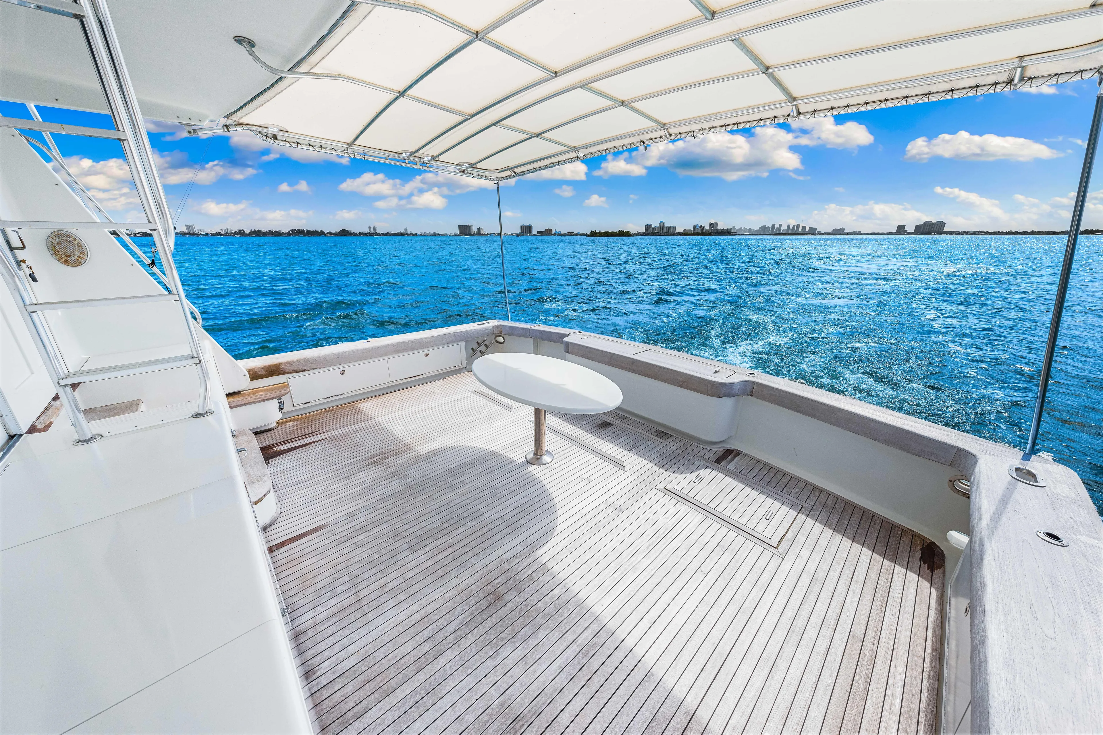 Bahama Belle Yacht Photos Pics Spacious deck of 1996 Blackwell 72 yacht with ocean view and canopy.