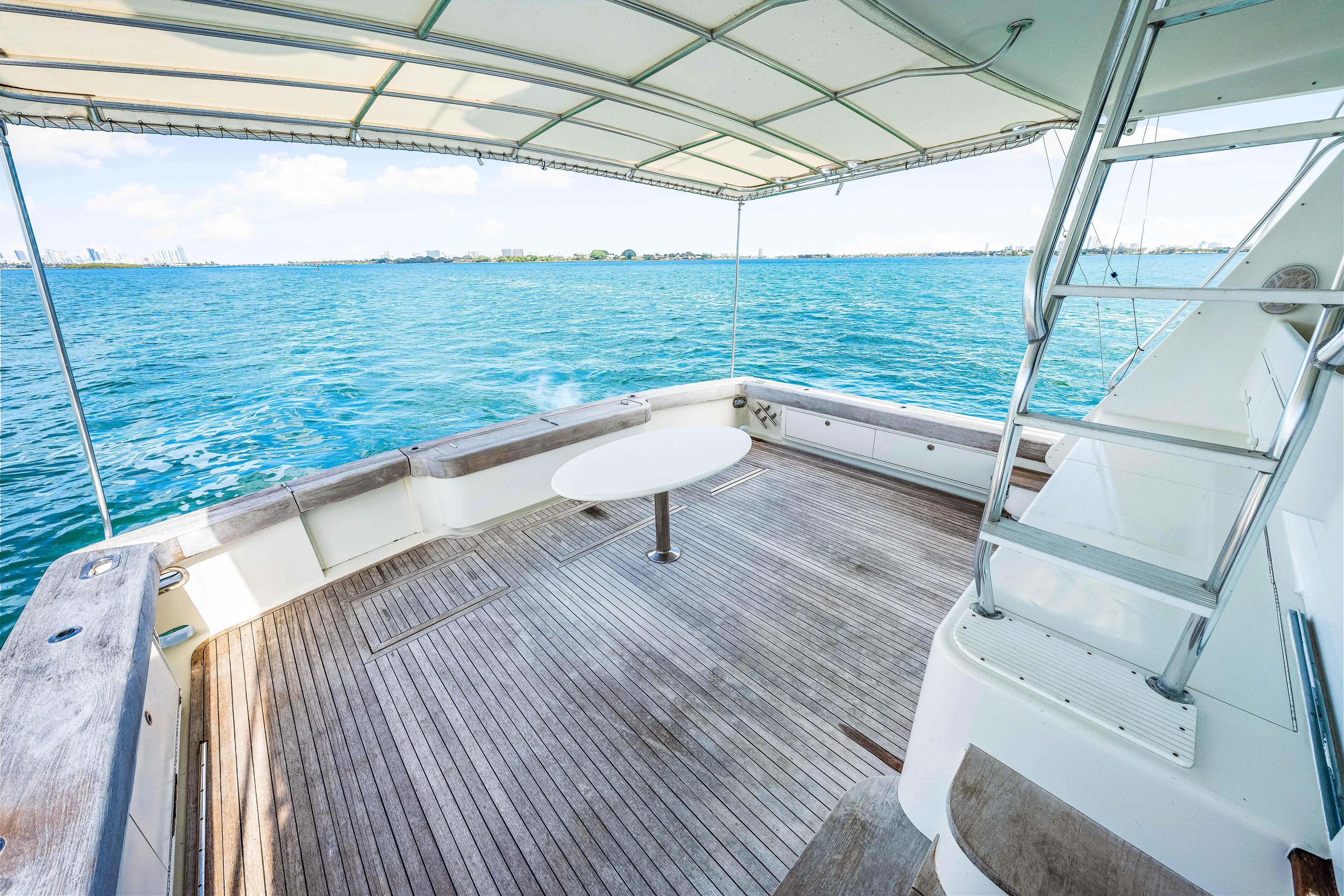 Bahama Belle Yacht Photos Pics Spacious deck of a 1996 Blackwell 72 yacht with ocean view.