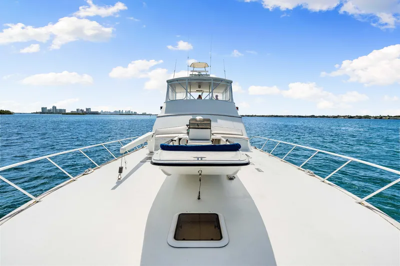 Bahama Belle Yacht Photos Pics Luxury 1996 Blackwell 72 yacht cruising on open water under clear blue sky.