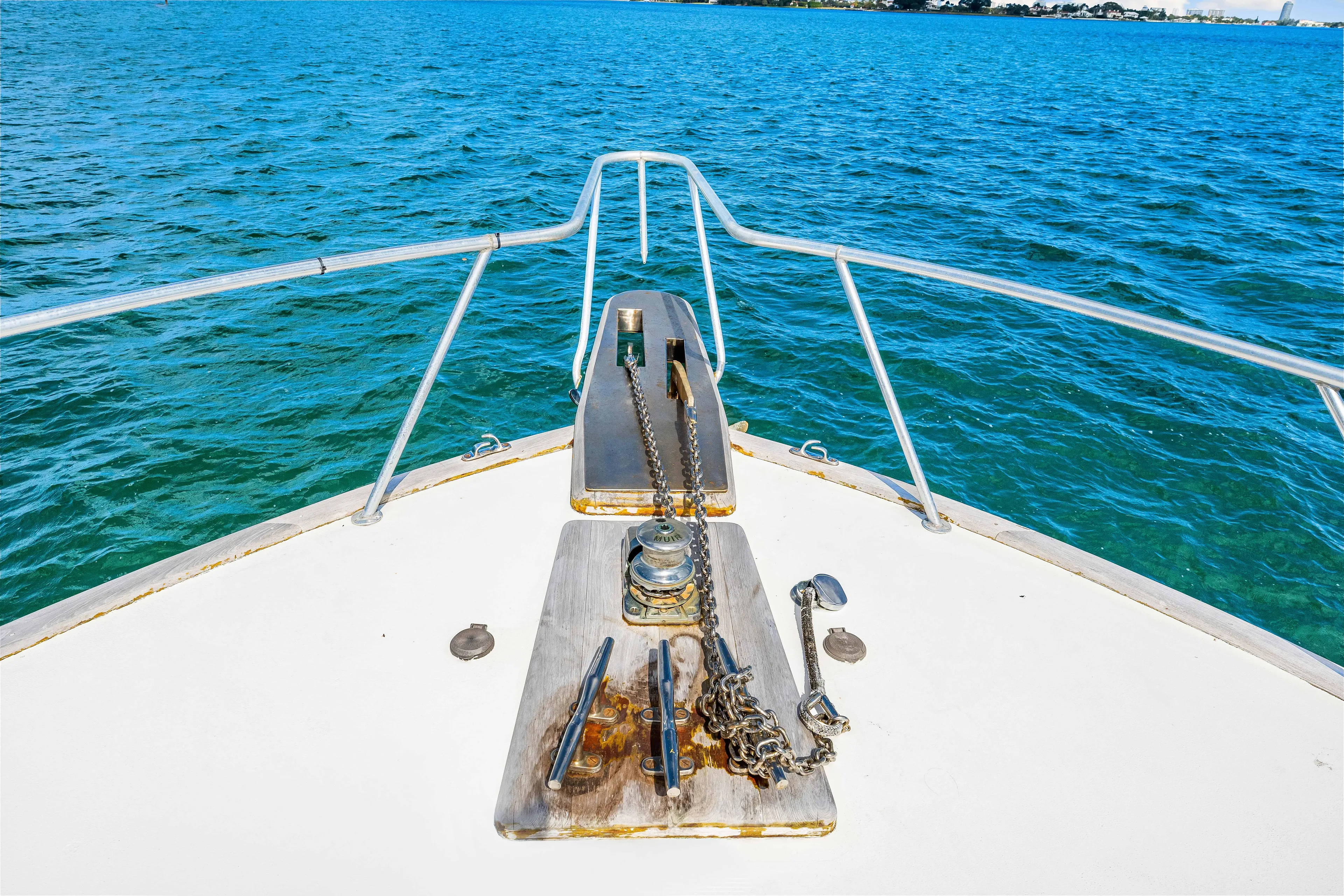 Bahama Belle Yacht Photos Pics Bow of 1996 Blackwell 72 boat on clear blue water.
