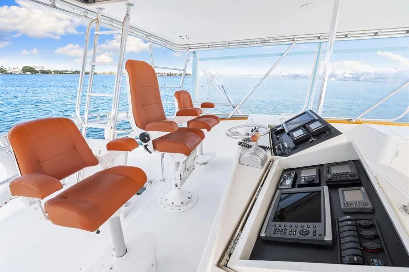 Bahama Belle Yacht Photos Pics Interior of 1996 Blackwell 72 yacht with navigation equipment and leather seats.