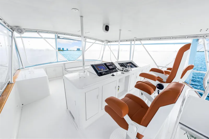 Bahama Belle Yacht Photos Pics Interior helm of 1996 Blackwell 72 yacht with leather seats and navigation equipment.