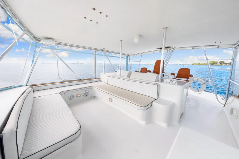 Bahama Belle Yacht Photos Pics Spacious deck of a 1996 Blackwell 72 yacht with white seating and ocean view.