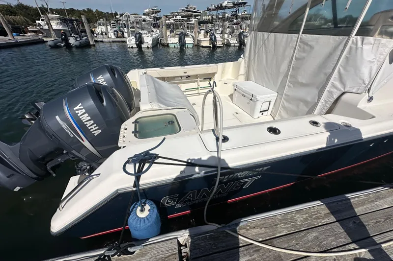  Yacht Photos Pics 2010 Pursuit OS 315 Offshore boat with Yamaha engines docked at marina.