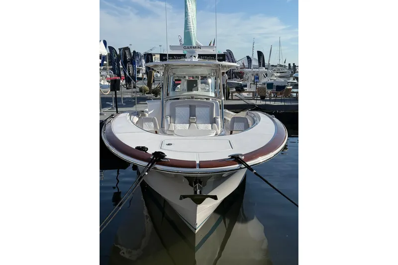  Yacht Photos Pics 2026 Mag Bay 38 CC boat docked at marina, showcasing sleek design and modern features.