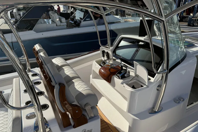  Yacht Photos Pics 2026 Mag Bay 38 CC boat interior with sleek helm and seating.