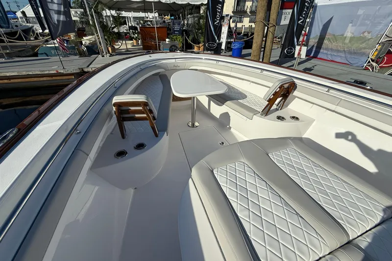  Yacht Photos Pics 2026 Mag Bay 38 CC boat interior with luxurious seating and table setup.