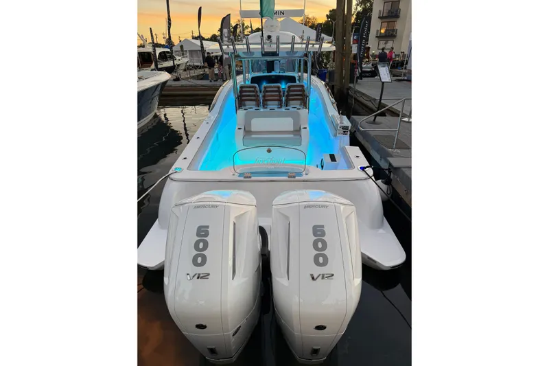  Yacht Photos Pics 2026 Mag Bay 38 CC boat with dual Mercury 600 V12 engines, docked at sunset.