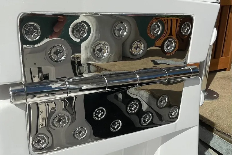  Yacht Photos Pics Close-up of a shiny metal hinge on a 2026 Mag Bay 38 CC boat.