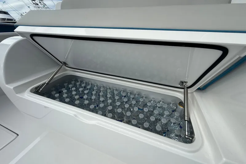  Yacht Photos Pics Storage compartment filled with water bottles on a 2026 Mag Bay 38 CC boat.