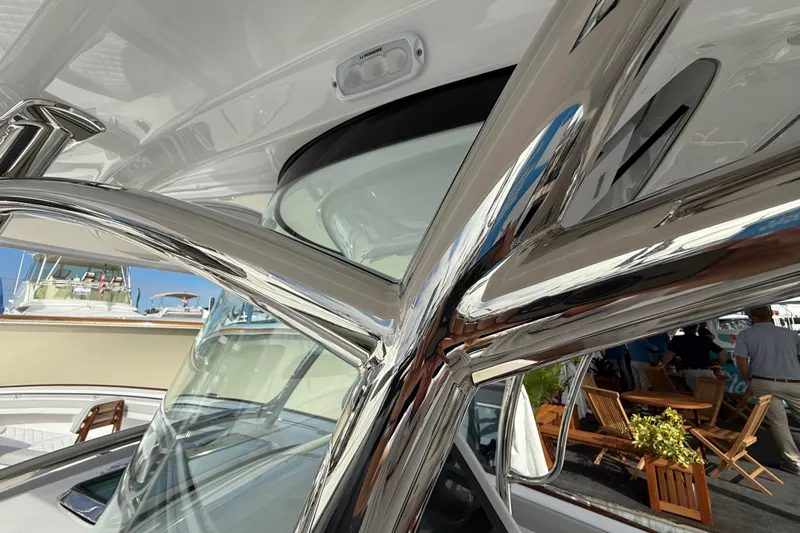  Yacht Photos Pics 2026 Mag Bay 38 CC boat with sleek chrome details and modern design.