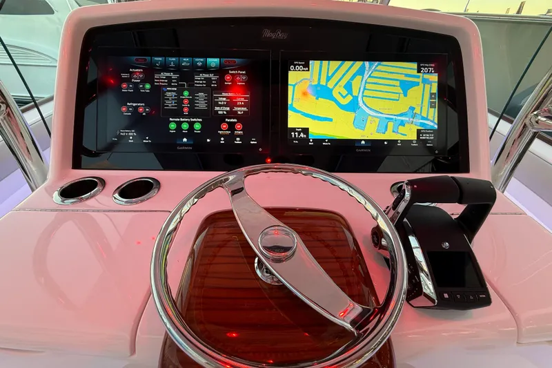  Yacht Photos Pics 2026 Mag Bay 38 CC helm with dual Garmin displays and modern steering wheel.