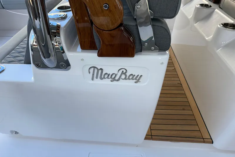  Yacht Photos Pics 2026 Mag Bay 38 CC boat interior with logo and wooden accents.