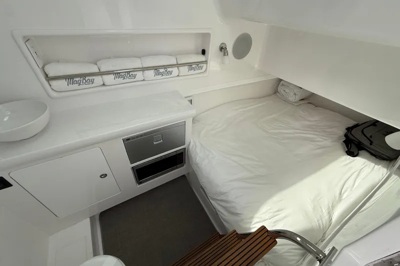  Yacht Photos Pics 2026 Mag Bay 38 CC cabin interior with bed, storage, and modern amenities.