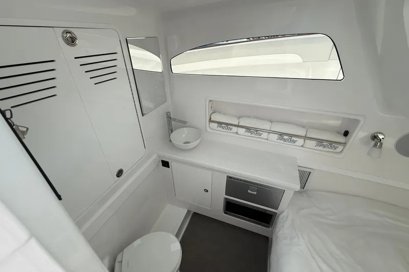  Yacht Photos Pics 2026 Mag Bay 38 CC cabin interior with modern amenities and sleek design.