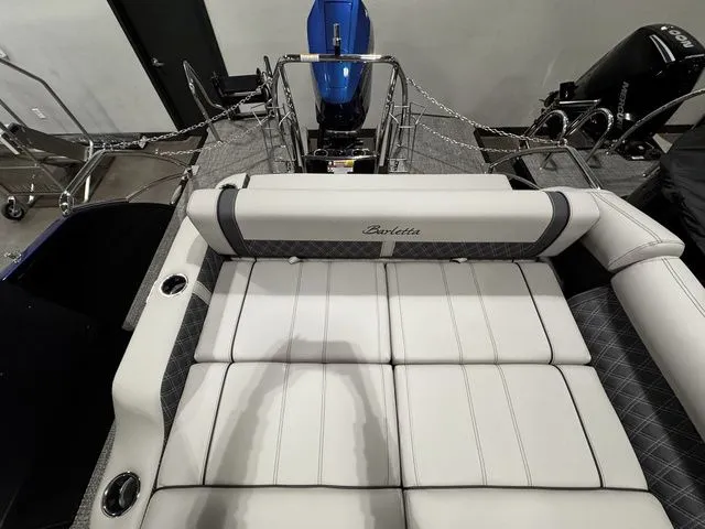 2025 Barletta Boats R23UCA interior with luxurious white seating and modern design.