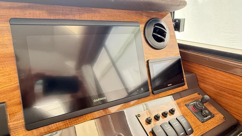  Yacht Photos Pics 2026 Ranger Tugs R-27 dashboard with Garmin display and control panel.