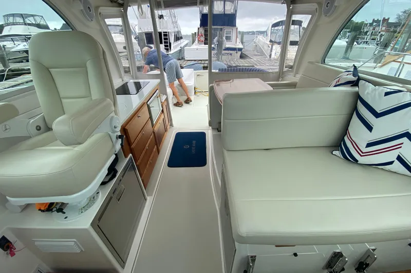 Laure Marie Yacht Photos Pics Interior of 2020 Back Cove 34O yacht with white seating and nautical decor.