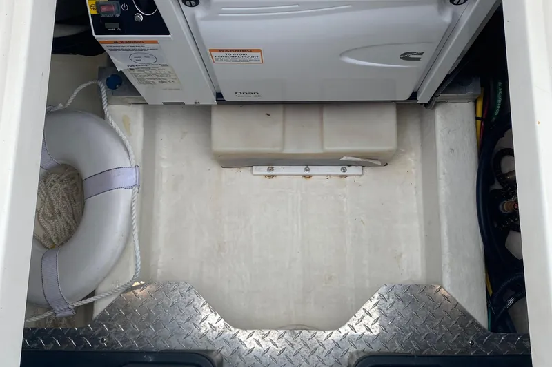 Laure Marie Yacht Photos Pics Engine compartment of 2020 Back Cove 34O boat with generator and life preserver.