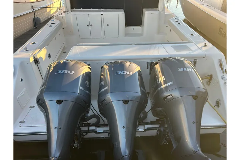  Yacht Photos Pics 2014 Pursuit OS 385 Offshore boat with triple Yamaha 300 engines, docked at marina.