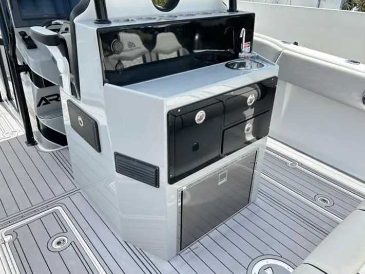  Yacht Photos Pics Modern AMP Arth 333 boat interior with sink, storage drawers, and sleek design, 2023 model.