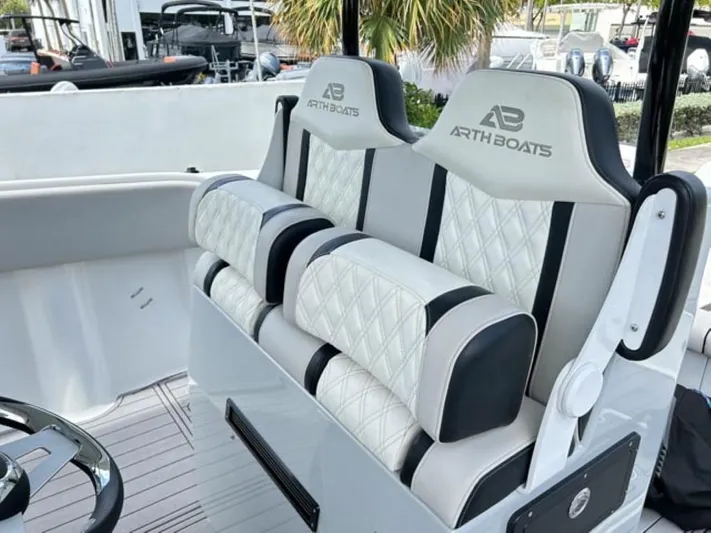  Yacht Photos Pics Luxury seating on AMP Arth 333 boat, 2023 model, featuring diamond-stitched upholstery.