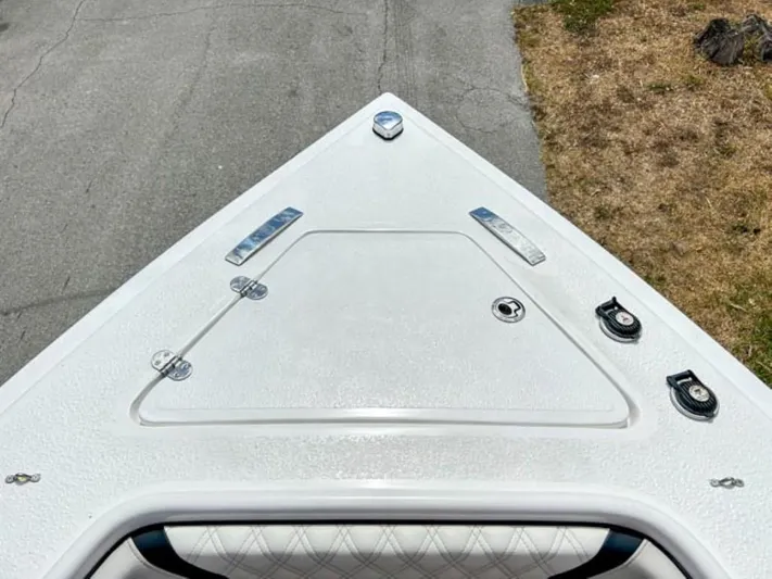  Yacht Photos Pics Top view of AMP Arth 333 boat's bow, 2023 model, on a concrete surface.