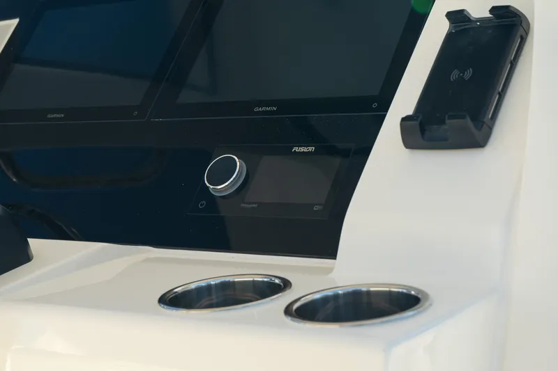  Yacht Photos Pics 2025 Scout 261 XSS boat dashboard with cup holders and electronic controls.