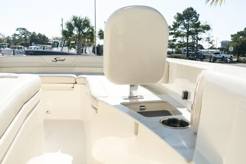  Yacht Photos Pics 2025 Scout 261 XSS boat interior with seating and cup holder, outdoor setting.