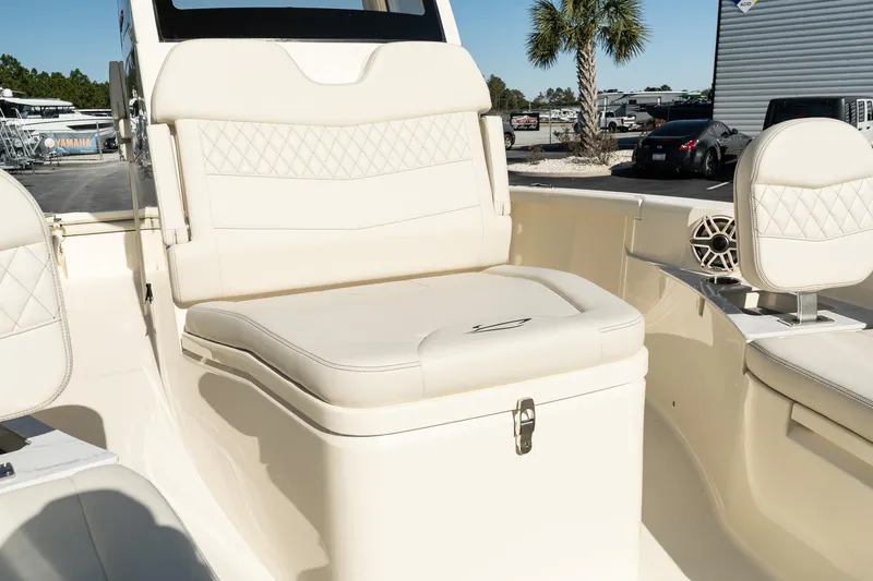  Yacht Photos Pics 2025 Scout 261 XSS boat interior with beige seating and storage.
