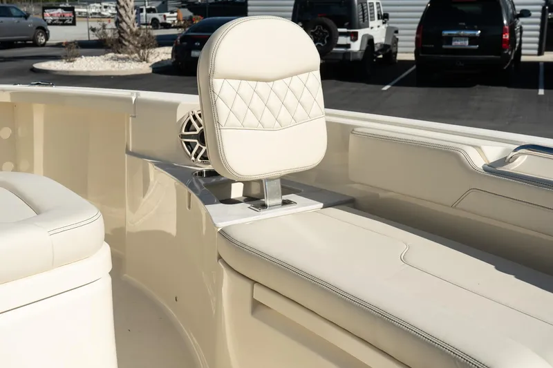  Yacht Photos Pics 2025 Scout 261 XSS boat interior with cream leather seating and speaker.