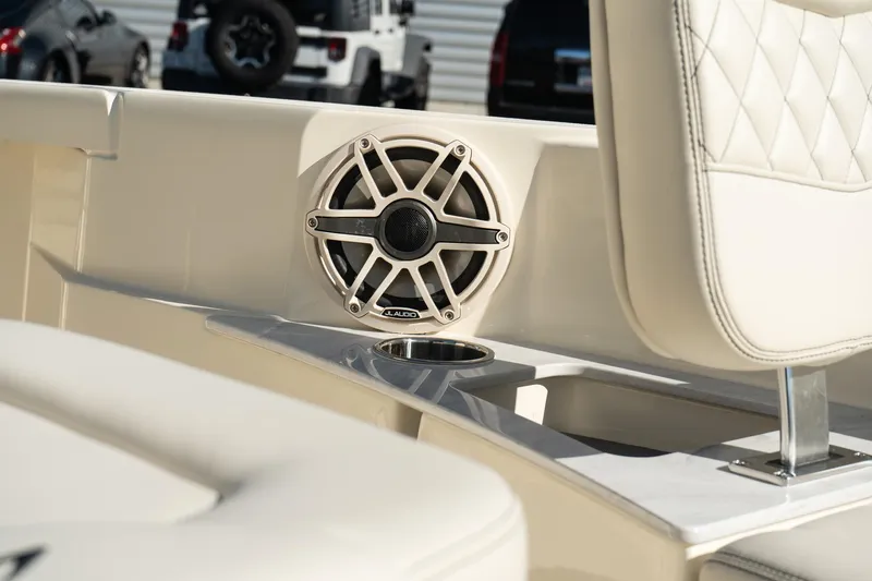  Yacht Photos Pics 2025 Scout 261 XSS boat interior with speaker and cushioned seating.