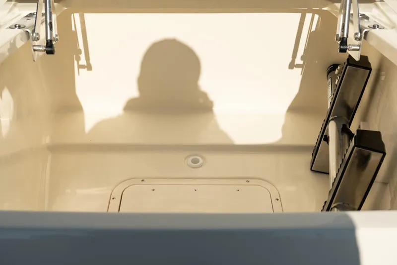  Yacht Photos Pics 2025 Scout 261 XSS boat interior with shadow and storage compartment.