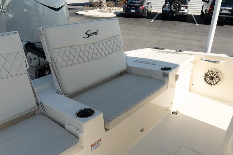  Yacht Photos Pics 2025 Scout 261 XSS boat interior with cushioned seating and cup holders.