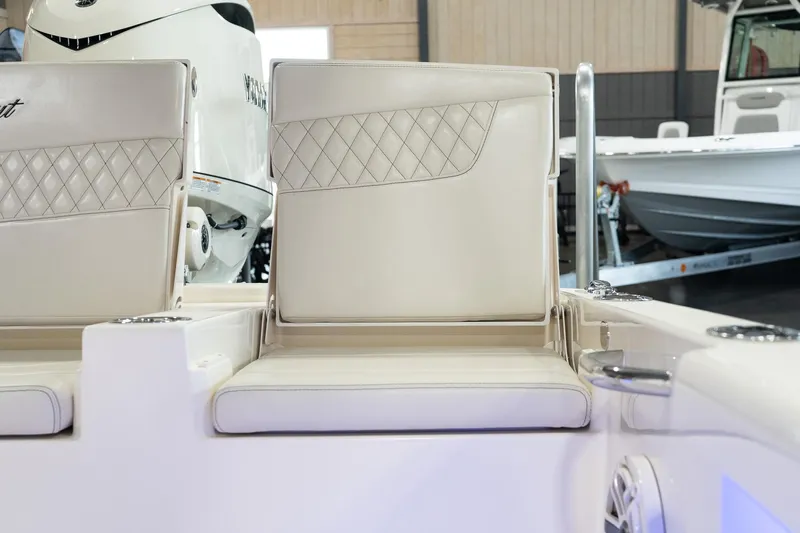  Yacht Photos Pics 2025 Scout 261 XSS boat interior with white cushioned seating.