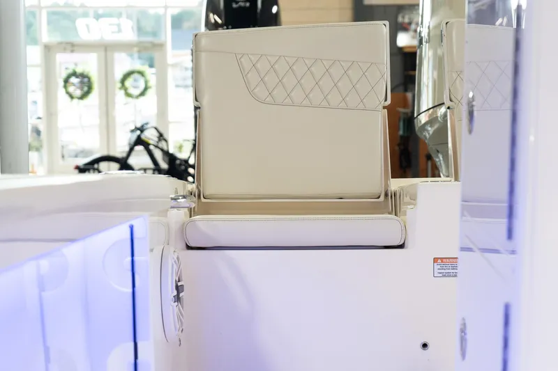  Yacht Photos Pics 2025 Scout 261 XSS boat interior with beige seating and quilted design.