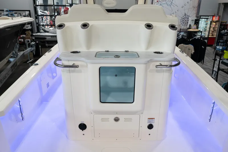  Yacht Photos Pics 2025 Scout 261 XSS boat interior with illuminated deck and storage compartment.