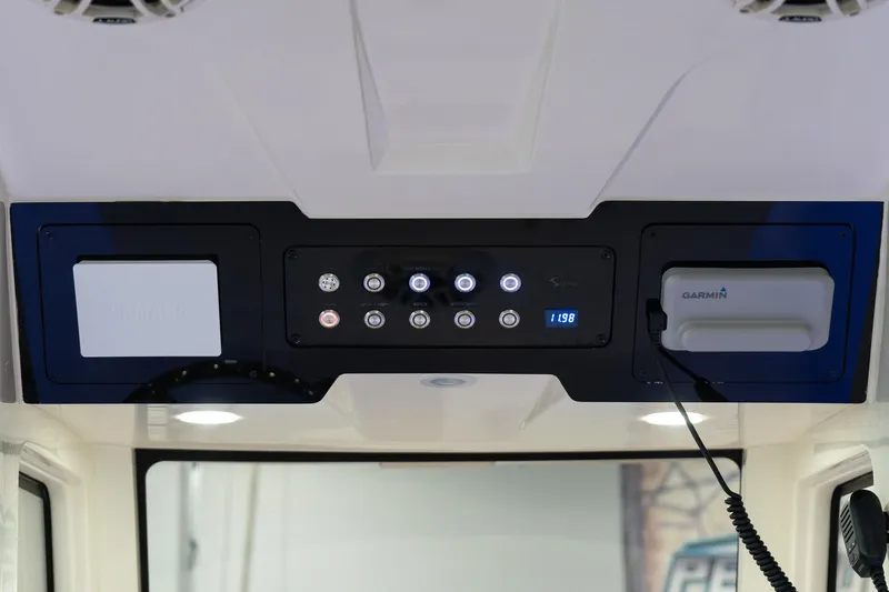  Yacht Photos Pics 2025 Scout 261 XSS boat control panel with modern navigation system.