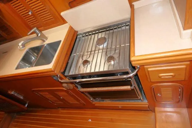 Peregrine Yacht Photos Pics Galley kitchen in 2002 Tayana 460 Vancouver Pilothouse with stove and sink.