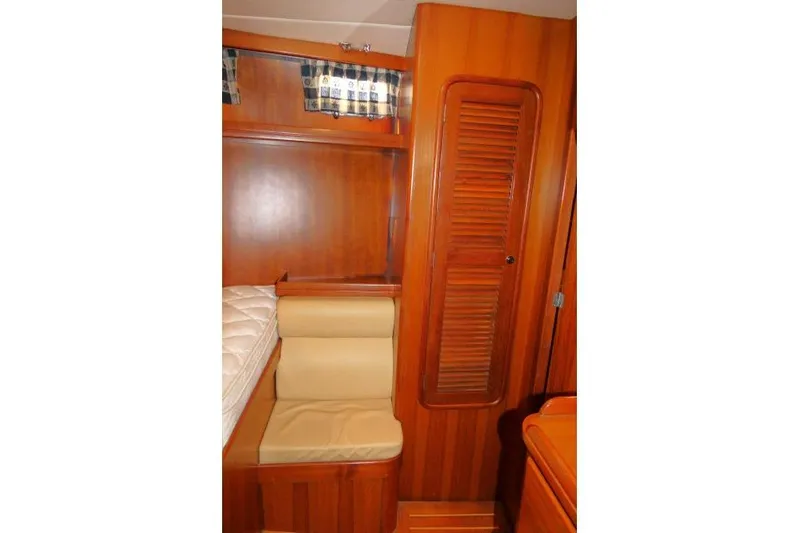 Peregrine Yacht Photos Pics 2002 Tayana 460 Vancouver Pilothouse interior with wooden cabinetry and seating area.