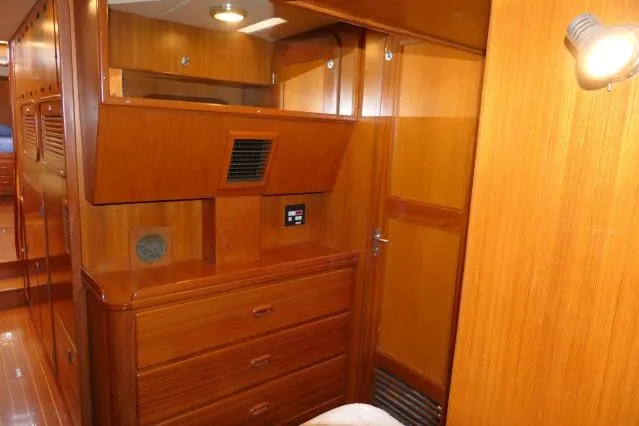 Peregrine Yacht Photos Pics Interior of 2002 Tayana 460 Vancouver Pilothouse with wooden cabinetry and lighting.
