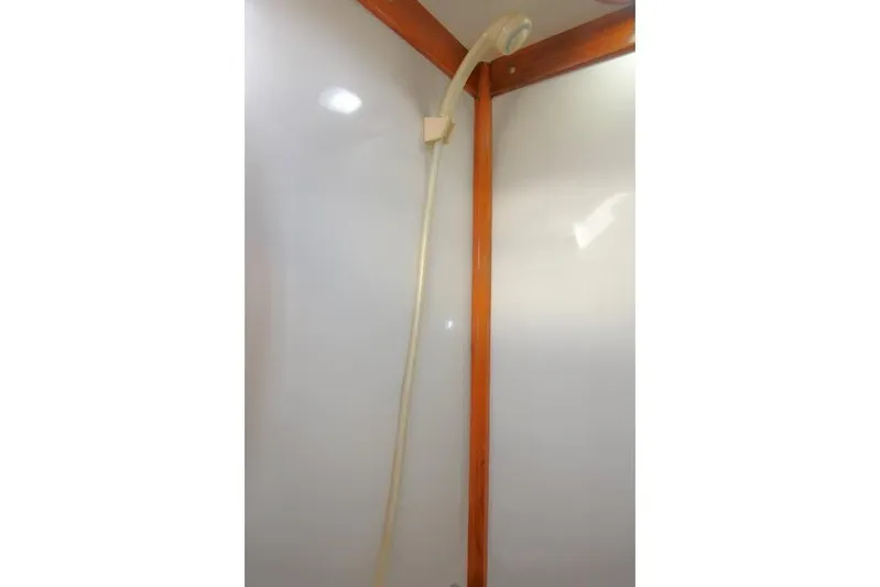 Peregrine Yacht Photos Pics Shower area in 2002 Tayana 460 Vancouver Pilothouse with wooden trim and white walls.