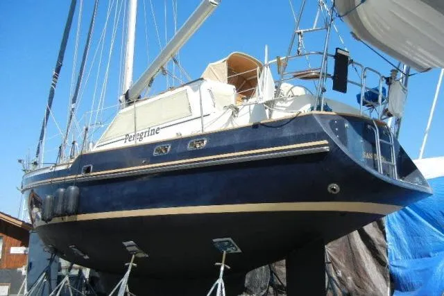 Peregrine Yacht Photos Pics 2002 Tayana 460 Vancouver Pilothouse sailboat on dry dock, blue hull, sunny day.