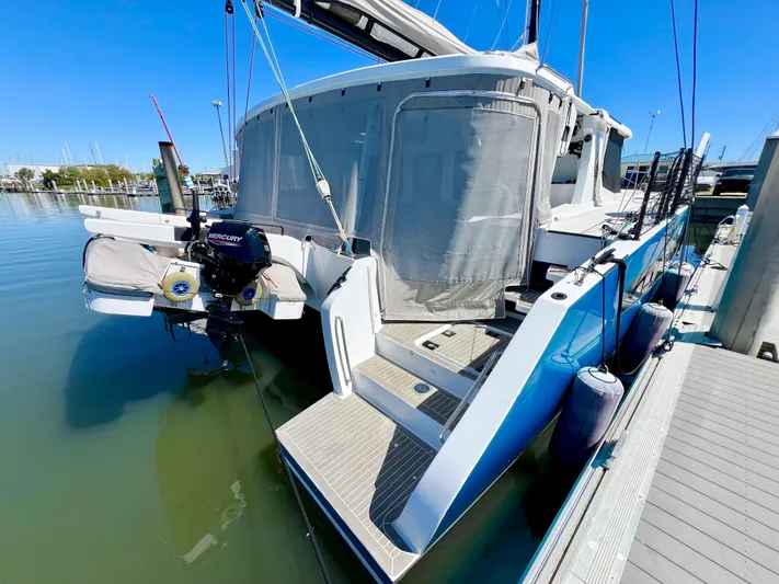Silver Chain Yacht Photos Pics 2024 Balance 442 yacht docked, featuring a modern design and outboard motor.
