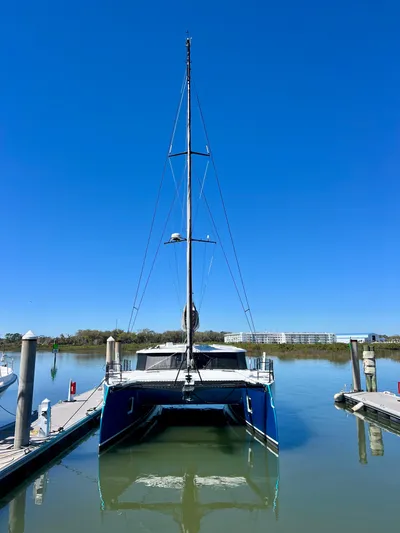 Silver Chain Yacht Photos Pics 2024 Balance 442 catamaran docked in a serene marina under clear blue skies.