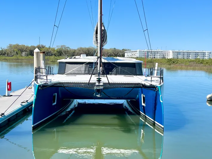 Silver Chain Yacht Photos Pics 2024 Balance 442 catamaran docked in calm waters, clear blue sky background.