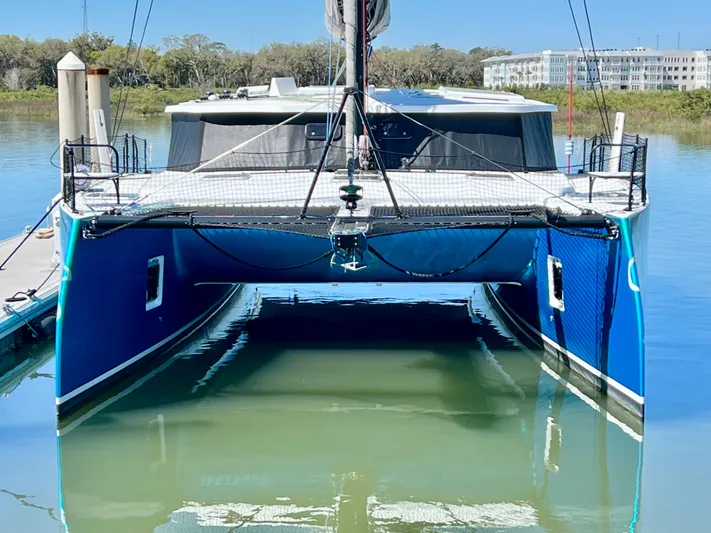 Silver Chain Yacht Photos Pics 2024 Balance 442 catamaran docked on calm water, showcasing sleek blue hull design.